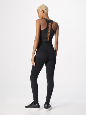 NIKE Skinny Sporthose in Schwarz