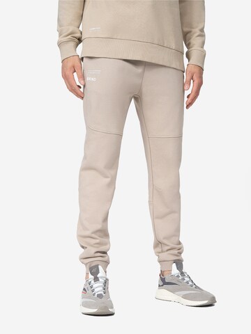 4F Tapered Workout Pants in Beige: front