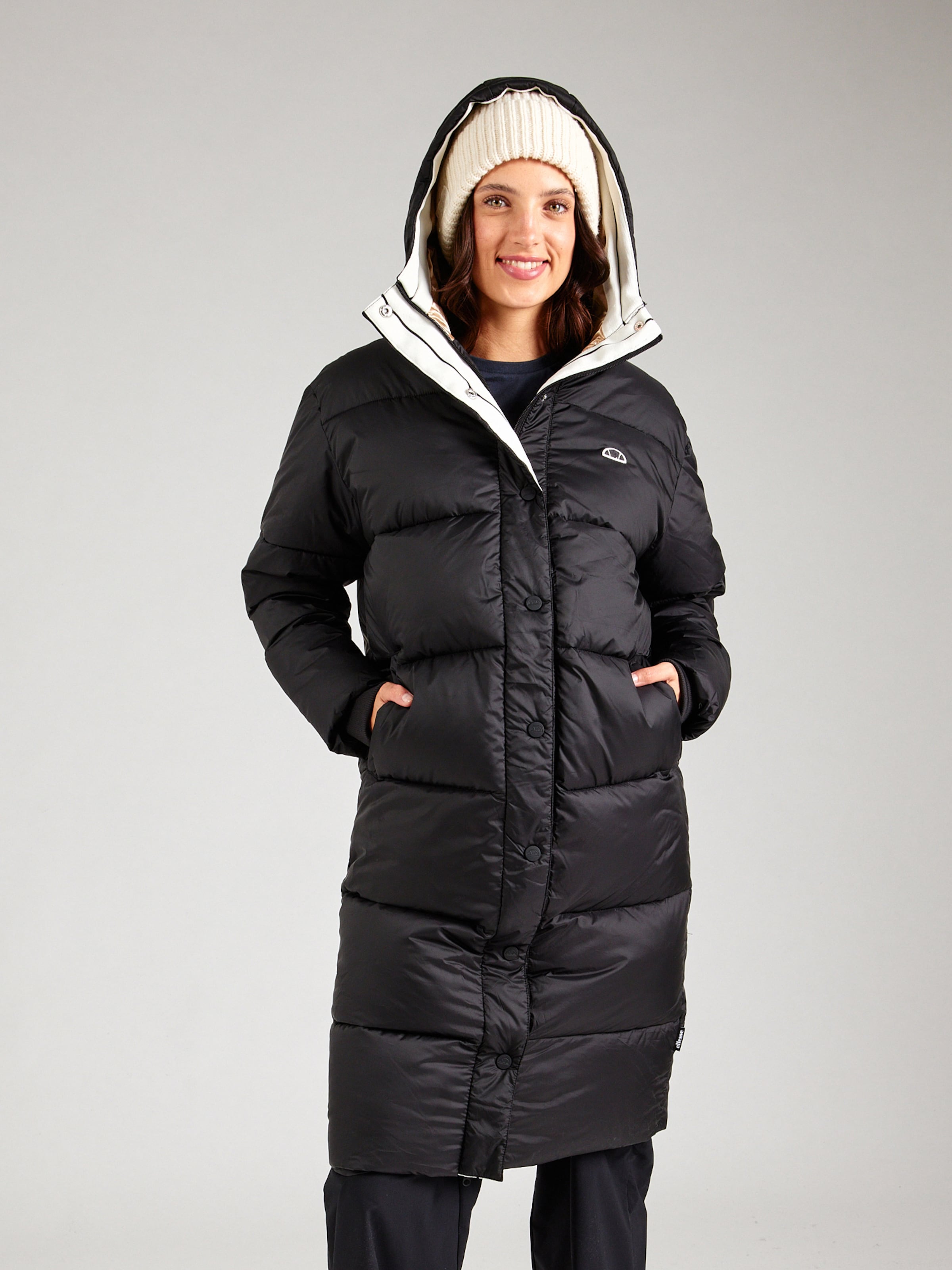 ELLESSE Between seasons coat in Black ABOUT YOU