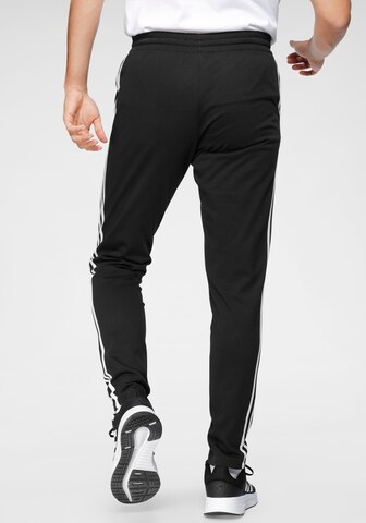 ADIDAS SPORTSWEAR Tapered Urheiluhousut 'Essentials' värissä musta