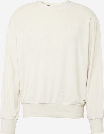 Sweat-shirt Calvin Klein Jeans en beige : devant