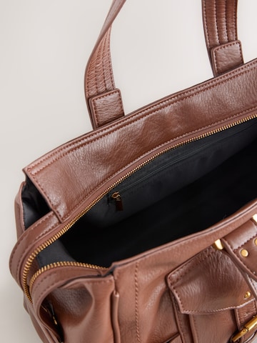 Next Shopper in Bruin