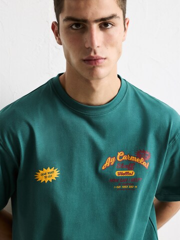Pull&Bear Koszulka 'AY CARMELA' w kolorze zielony
