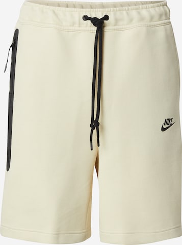 Nike Sportswear - Pantalón 'TCH FLC' en verde: frente
