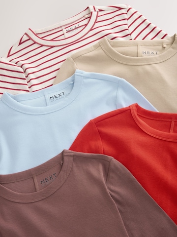 Tricou de la Next pe bej