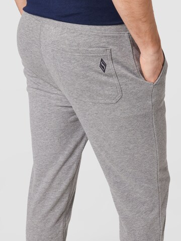 SKECHERS Tapered Sports trousers in Grey