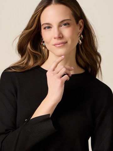 Pullover di oltre in nero