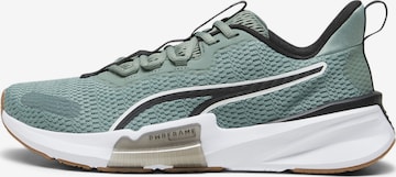 PUMA Athletic Shoes in Green: front