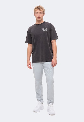 UNDER ARMOUR Performance Shirt 'PROPERTY OF UA' in Black
