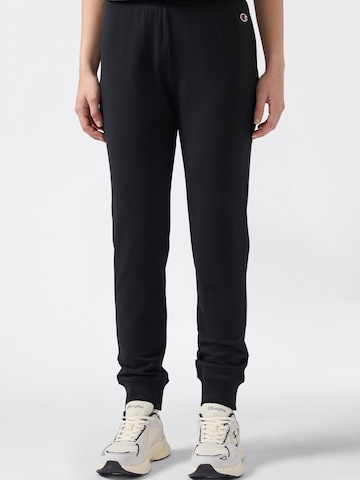 Champion Authentic Athletic Apparel - Tapered Calças em preto: frente