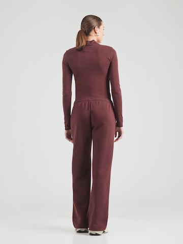 Nike Sportswear Loose fit Trousers 'PHNX FLC' in Red