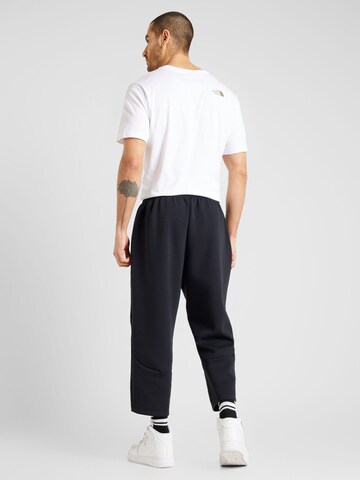 Tapered Pantaloni sport 'Unstoppable' de la UNDER ARMOUR pe negru