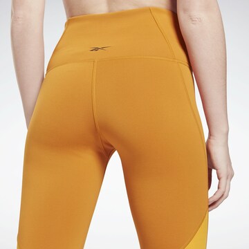 Reebok Skinny Sportbroek in Oranje