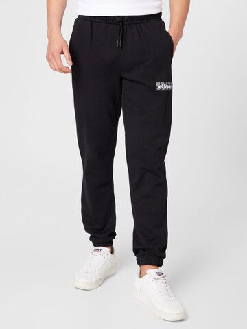 ELLESSE Tapered Trousers in Black: front