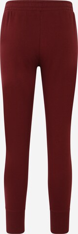 Tapered Pantaloni sportivi 'Rival' di UNDER ARMOUR in rosso