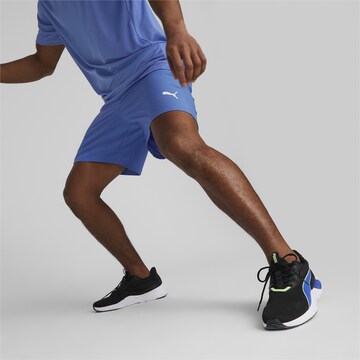 PUMA Regular Workout Pants in Blue: front