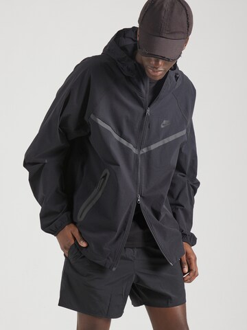 Nike Sportswear Between-season jacket 'Tech' in Black: front