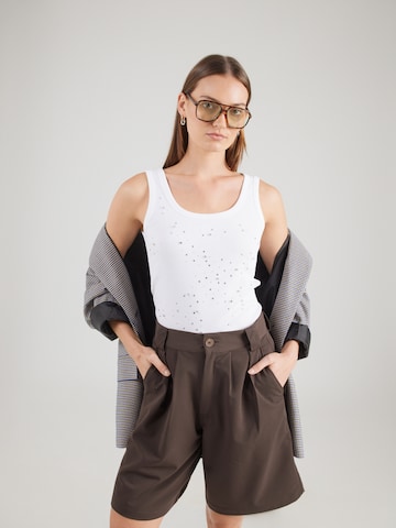 Top di monari in beige: frontale