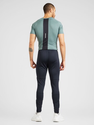 UNDER ARMOUR Slim fit Sports trousers 'Challenger' in Black