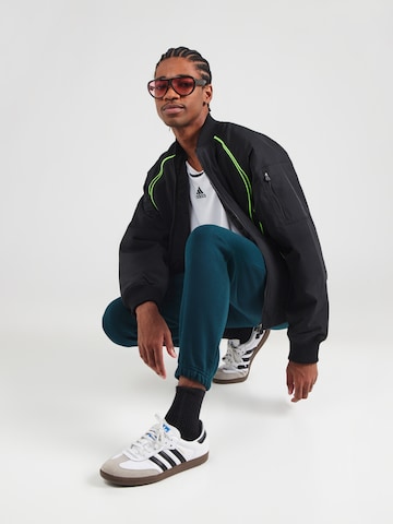 ADIDAS ORIGINALS Tapered Παντελόνι 'ESS' σε πράσινο