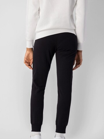 Tapered Pantaloni di Champion Authentic Athletic Apparel in nero