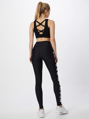 Skinny Pantalon de sport UNDER ARMOUR en noir