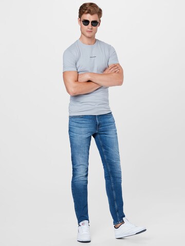 Calvin Klein Jeans Tričko - Sivá