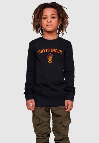 Maglietta 'Harry Potter - Hogwarts Gryffindor Crest' di ABSOLUTE CULT in nero: frontale