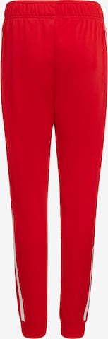 ADIDAS ORIGINALS Tapered Pants 'Adicolor Sst' in Red