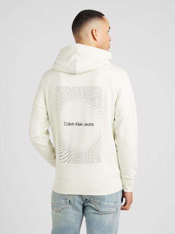 Sweat-shirt Calvin Klein Jeans en blanc : devant