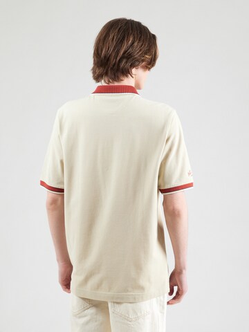 Tricou de la La Martina pe bej: spate