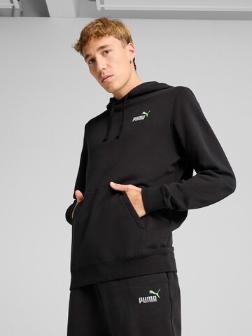 PUMA Sportsweatshirt 'ESS No. 1' in Schwarz: Vorderseite