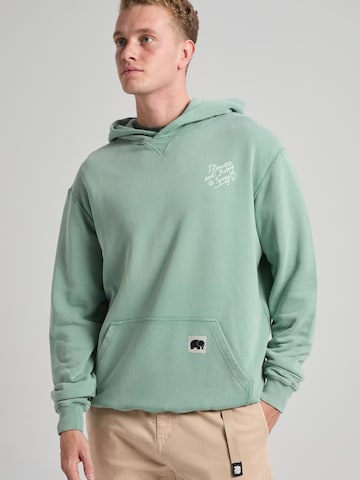 Trendsplant Bluzka sportowa 'FLOWERS' w kolorze zielony: przód