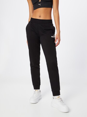 Effilé Pantalon de sport PUMA en noir : devant