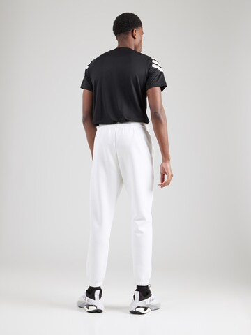 ADIDAS SPORTSWEAR Tapered Sports trousers in White
