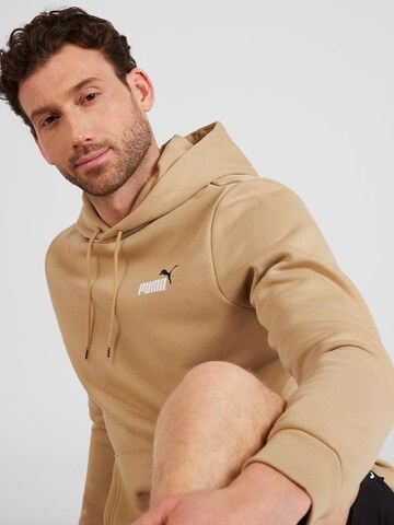 PUMA Sports sweatshirt 'ESS+' in Brown