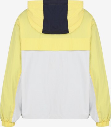 Tommy Jeans Between-Season Jacket 'Chicago' in Yellow