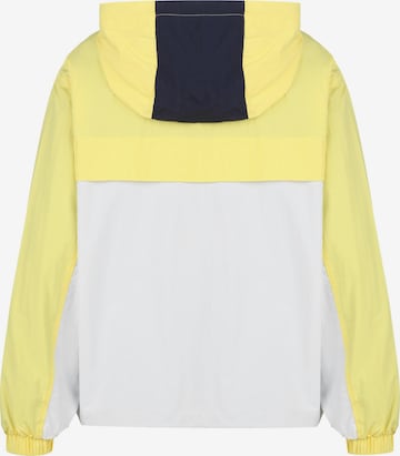 Tommy Jeans Overgangsjakke 'Chicago' i gul