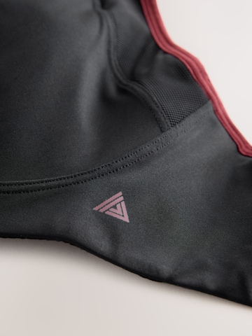 Next Bustier Urheilurintaliivit värissä musta