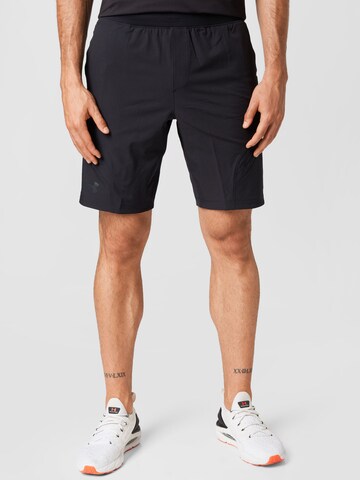 UNDER ARMOUR Regular Workout Pants in Black: front