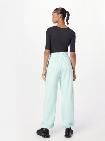 Nike Sportswear Tapered Pants in Green
