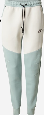 Pantalon 'TCH FLC' Nike Sportswear en vert : devant