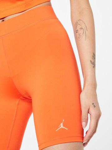 Jordan Skinny Workout Pants in Orange