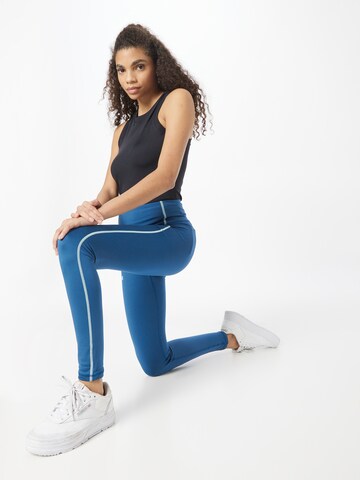 Skinny Pantalon de sport UNDER ARMOUR en bleu