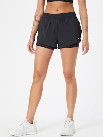 Reebok - Skinny Calças de desporto em preto: frente