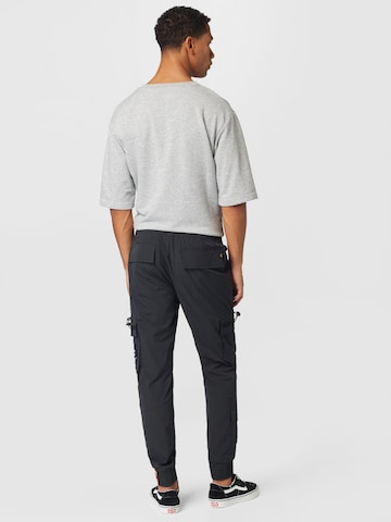 ALPHA INDUSTRIES Tapered Cargobyxa i svart