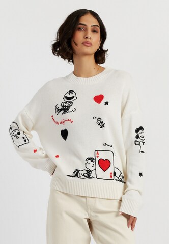 Chinti & Parker Trui 'Autumn Peanuts '25 Charlie Poker Pals' in Beige: voorkant