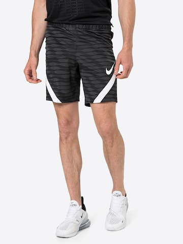 NIKE Regular Workout Pants in Black: front