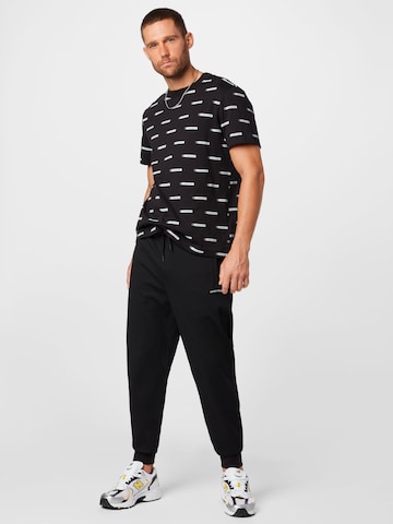 Calvin Klein Jeans - Tapered Pantalón en negro