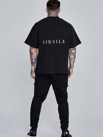 Effilé Pantalon cargo 'Essentials' SikSilk en noir